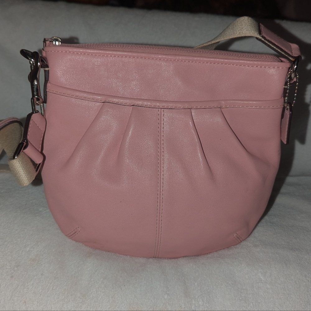 Coach pink leather soho swing pack crossbody bag.